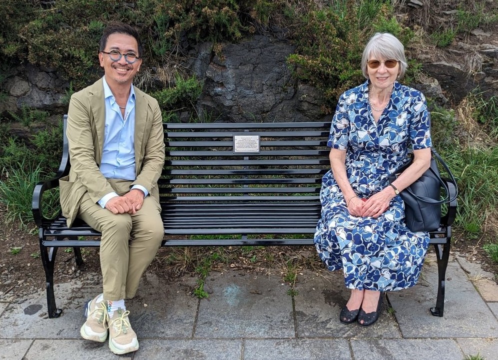 Memorial bench for Douglas Ford GC on Calton Hill, Edinburgh. Douglas's niece on the right, sponsor Boroday Pang on the left